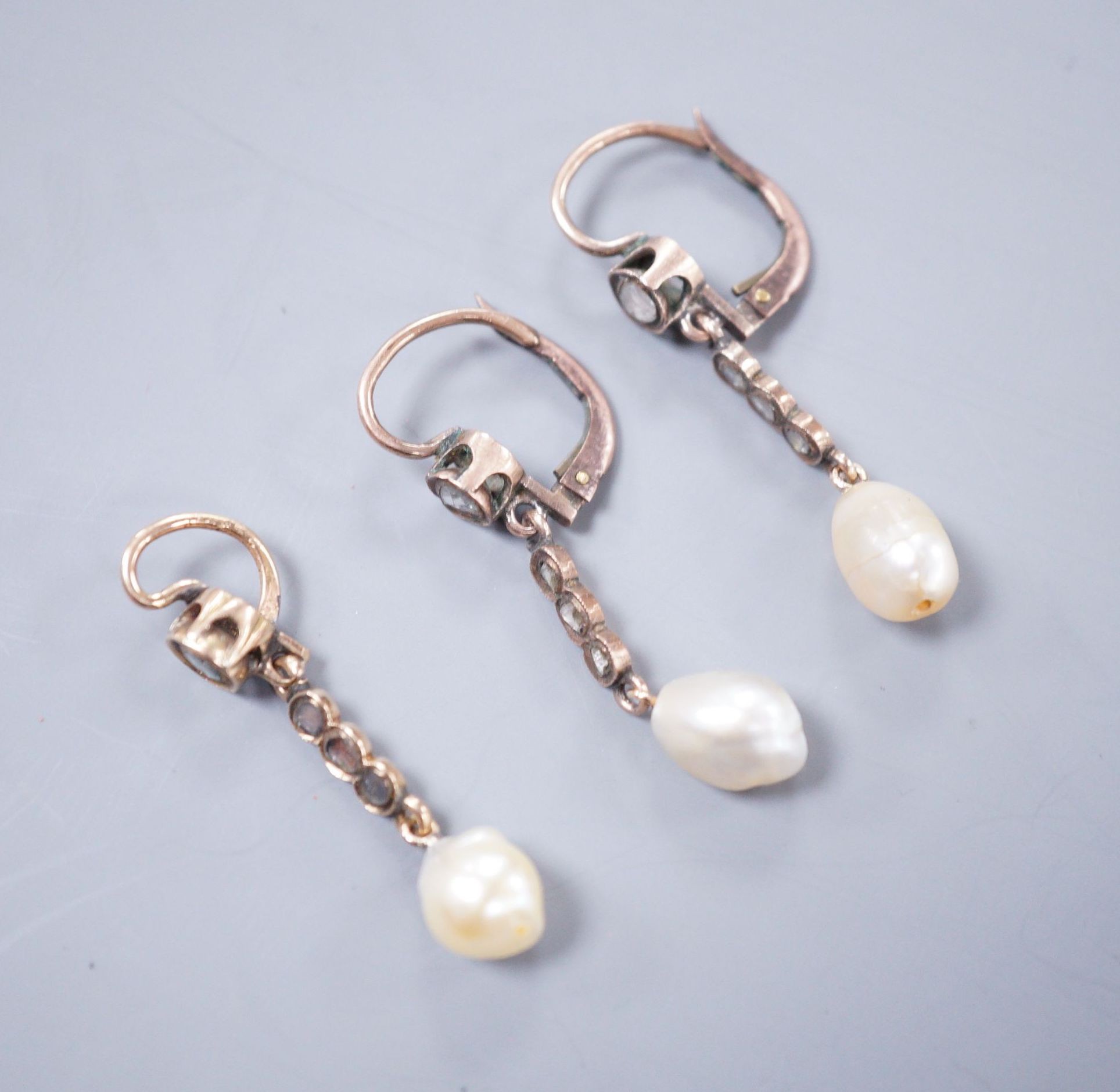 A pair of yellow metal, baroque pearl and rose cut diamond set drop earrings, 38mm and a similar pendant, gross weight 5.9 grams.